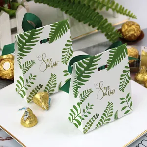 European style wedding favor box with green fern leaves and a Save the Date gold print