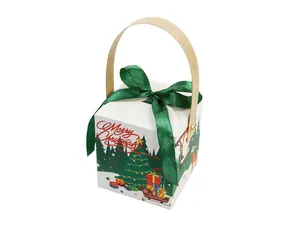 Detail of Christmas gift box featuring wood handle, green ribbon bow, and festive motifs