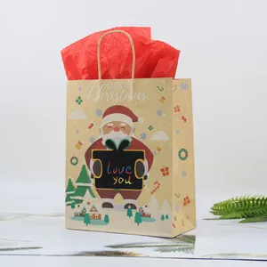 Christmas kraft paper gift bag with Santa Claus illustration and red tissue paper insert