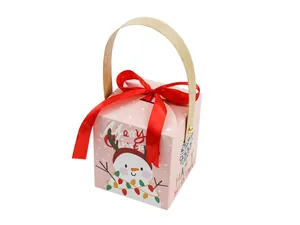 Detail of pink Christmas gift box with cute snowman illustration and red satin ribbon bow