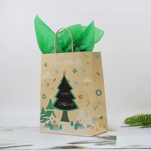 Brown kraft paper Christmas gift bag with festive tree print and green tissue paper