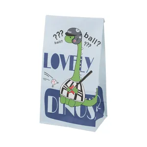 Detail of light blue paper bag showing cartoon baseball dinosaur and side fold texture