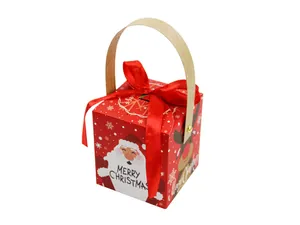 Detail view of red Christmas gift box with Santa Claus print and wood handle