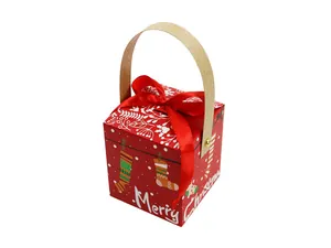 Close-up of red square Christmas gift box with Merry Christmas text and wooden handle