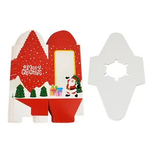 Flat lay of red Christmas muffin boxes with clear windows and white cupcake inserts