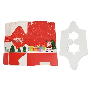 Close-up of red Christmas muffin box with snowflakes and Merry Christmas typography