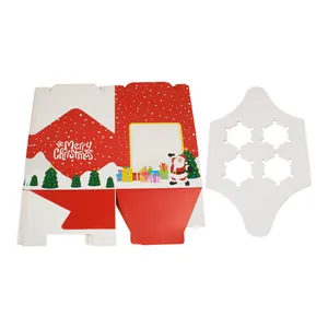 Close-up of a festive Merry Christmas gift box with 4-hole white paper cupcake insert