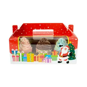 Detail of red Christmas cupcake box with festive Santa print and clear window window