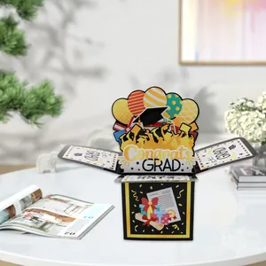 Detailed 3D pop-up graduation card box with Congrats GRAD lettering and festive icons