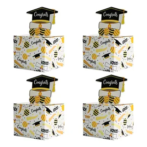 Detail view of a 4-pack graduation money box with black and gold celebratory patterns