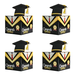 Detail of Graduation money boxes with 3D mortarboard caps and Congrats Grad text