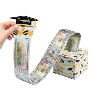 Detail view of graduation money pulling box with congrats balloon design and prop cash