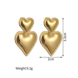 Detailed size view of stacked heart earrings in 18K gold plated stainless steel