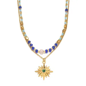 Double-layered gold titanium steel star necklace with blue crystal beads and green stone