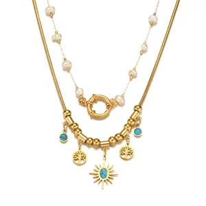 Mehrlagige Boho-Halskette in Gold mit Lebensbaum, Sonnenanhänger und Perlenkette
