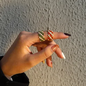 Gold plated stainless steel geometric rings with colorful enamel inlay on model hand