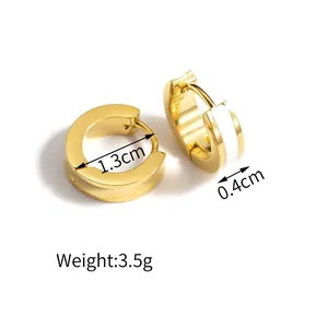 Detailed view of 1.3cm gold hoop earrings with white enamel inlay and size measurements