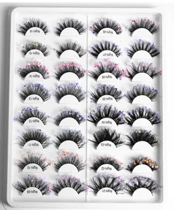 Macro display of 16 decorative false eyelashes with colorful glitter and sequins