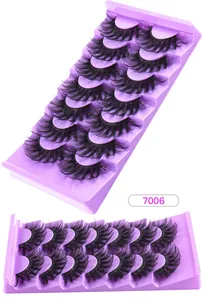 Detail of 3D layered thick false eyelashes displayed on a purple tray, model 7006