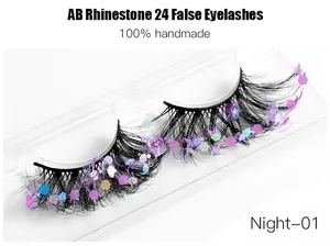 Macro detail of handmade dense black false eyelashes with colorful AB glitter sequins