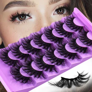 7 pairs of 3D faux mink eyelashes on purple tray with natural voluminous makeup look