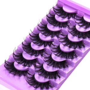 Set of 7 pairs of 3D faux mink false eyelashes in black on a purple tray backdrop
