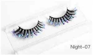 Detail of dramatic fake eyelashes with blue and purple sequins, style Night-07 on tray
