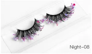 Macro view of Night-08 false eyelashes with pink-purple glitter on clear tray