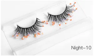 Detail of Night-10 false eyelashes with orange sequins and holographic glitter diamonds