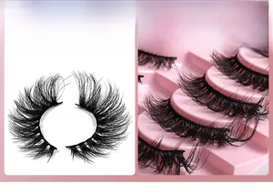Macro shot of 10 pairs of dense curly faux mink eyelashes on a pink display tray