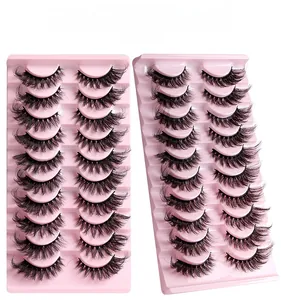 Detail of 10 pairs of multi-layered fox eye false eyelashes on pink display trays