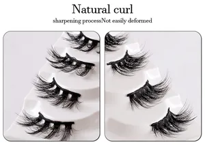 Detail showing natural curled half false eyelashes with sharpening process on white tray