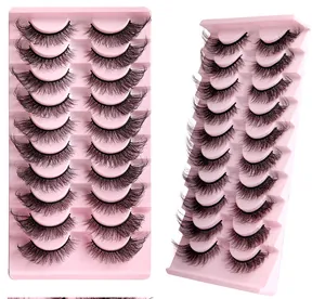 Macro view of 10 pairs of 3D layered fox eye eyelashes on a pink display tray