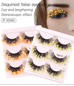 Close-up of Night-19 luminous sequin false eyelashes with orange-gold 3D winged effect