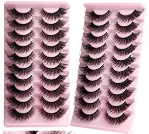Detail view of 20 pairs wispy cat eye false eyelashes on pink trays for makeup