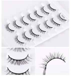 Detail view of 10 pairs of 7033 thick cross synthetic false eyelashes in a tray