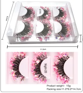 Detailed view of dense fake eyelashes set with sparkling pink glitter and dimensions