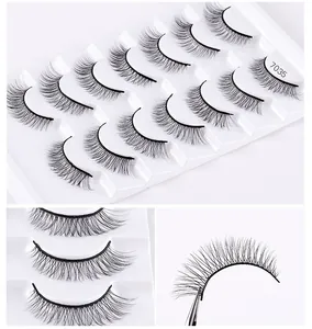 Detailed close-up of natural thick false eyelashes set with 10 pairs on white tray