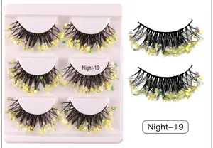Close-up of three pairs of dramatic false eyelashes with green sequins style Night-19