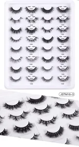 Macro detail of 16 pairs faux mink eyelashes with various lengths and styles in a tray