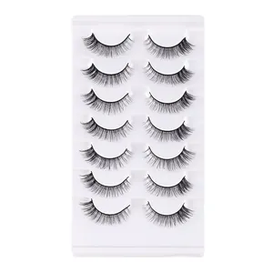 7 pairs of voluminous natural synthetic false eyelashes set on a white display tray