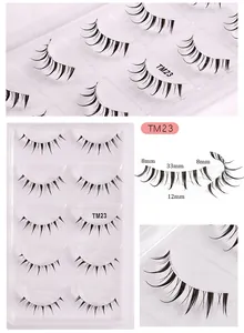 Detail view of TM23 faux lashes featuring clear bands and natural 8mm to 33mm volume