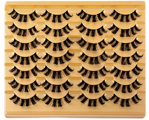 Macro detail of 14 pairs of D-curl thick segmented false eyelashes on gold display tray