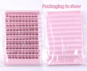 Detail of red and black dual-color cluster lashes in a pink tray with transparent packaging