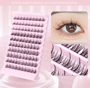 Macro view of black segmented anime COS eyelashes in a pink 10-row tray for 3D eye effect