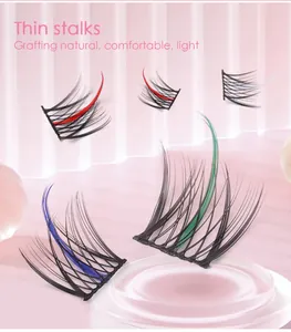 Detail view of thin stalks individual lashes with colorful accents on pink background