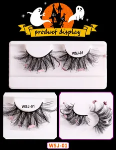 Detail of Halloween false eyelashes with pink spider, ghost and pumpkin ornaments