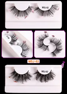 Detail view of dense Halloween faux mink eyelashes with pink bat and heart sequins