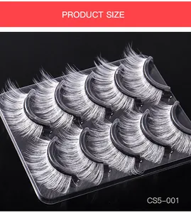 Detailed view of 5 pairs white synthetic false eyelashes for stage makeup on black background