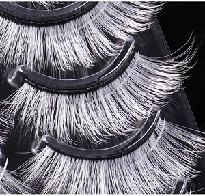 Macro shot of 5 pairs of white synthetic false eyelashes for stage makeup and cosplay